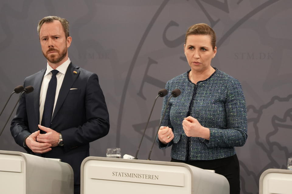 Liberal Party Chairman Jakob Ellemann-Jensen and Danish Prime Minister Mette Frederiksen, right, speak to the media during a press conference in Copenhagen, Sunday March 6, 2022. (Emil Helms/Ritzau Scanpix via AP)