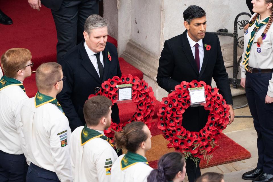 Britain's main opposition Labour Party leader Keir Starmer (L) and Britain's Prime Minister Rishi Sunak (R) come out to lay wreaths at The Cenotaph during the Remembrance Sunday ceremony on Whitehall in central London, on November 13, 2022. - Remembrance Sunday is an annual commemoration held on the closest Sunday to Armistice Day, November 11, the anniversary of the end of the First World War and services across Commonwealth countries remember servicemen and women who have fallen in the line of duty since WWI. (Photo by Stefan Rousseau / POOL / AFP) (Photo by STEFAN ROUSSEAU/POOL/AFP via Getty Images)