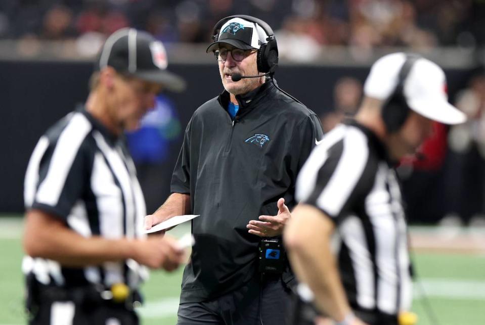 Carolina Panthers head coach Frank Reich talks with personnel upstairs as the team battles the Atlanta Falcons at Mercedes-Benz Stadium in Atlanta, GA on Sunday, September 10, 2023. The Falcons defeated the Panthers 24-10.