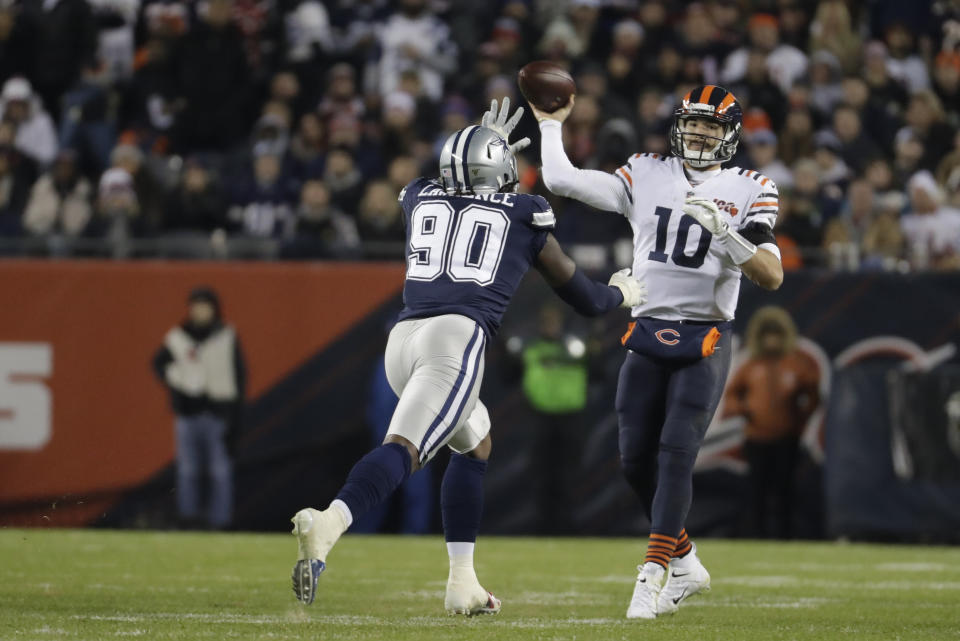 Chicago Bears quarterback Mitchell Trubisky (10) throws against Dallas Cowboys' Demarcus Lawrence (90) during the second half of an NFL football game, Thursday, Dec. 5, 2019, in Chicago. (AP Photo/Morry Gash)