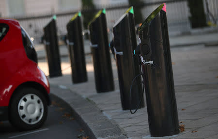 An electric car is plugged into a charging point in London, Britain September 1, 2017. REUTERS/Hannah McKay