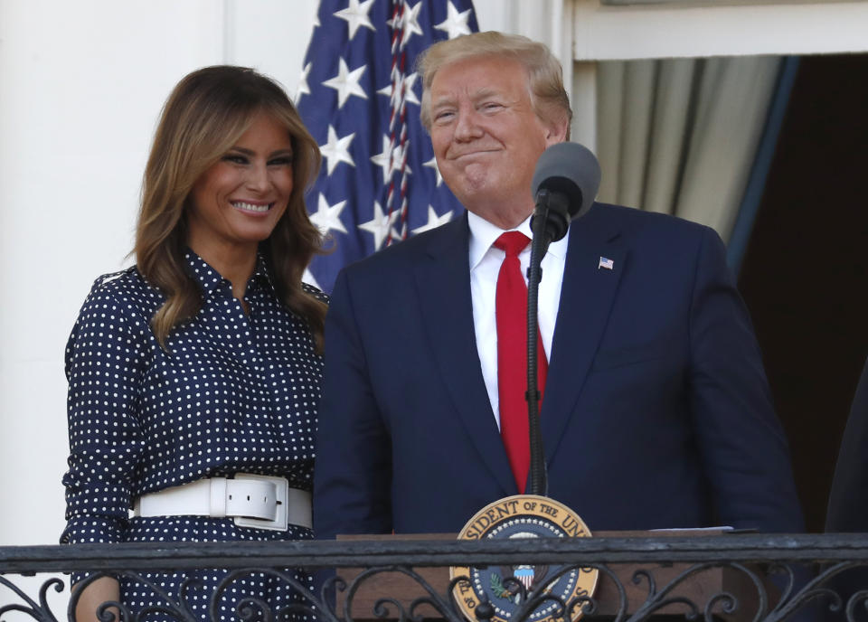 President Donald Trump, with first lady Melania Trump speaks from the Truman Balcony of the White House during the annual Congressional Picnic on the South Lawn, Friday June 21, 2019, in Washington. (AP Photo/Jacquelyn Martin)