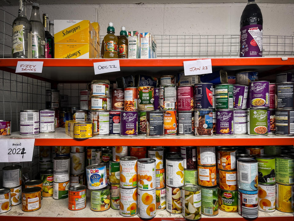 Donated food is seen stored on shelves inside a food bank. (Getty Images)