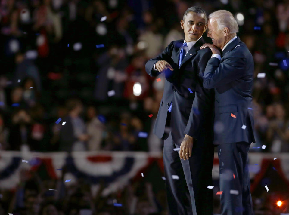 Vice President Joe Biden, right, talks to President Barack Obama at their election night party Wednesday, Nov. 7, 2012, in Chicago. President Obama defeated Republican challenger former Massachusetts Gov. Mitt Romney. (AP Photo/M. Spencer Green)