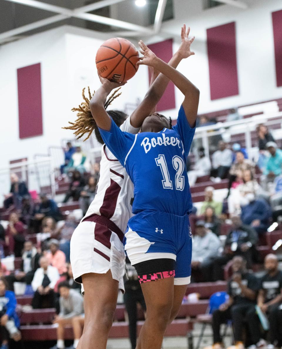 Taniyah Thompson (12) shoots during the Booker T. Washington vs Pensacola girls basketball game at Pensacola High School on Friday, Jan. 20, 2023.