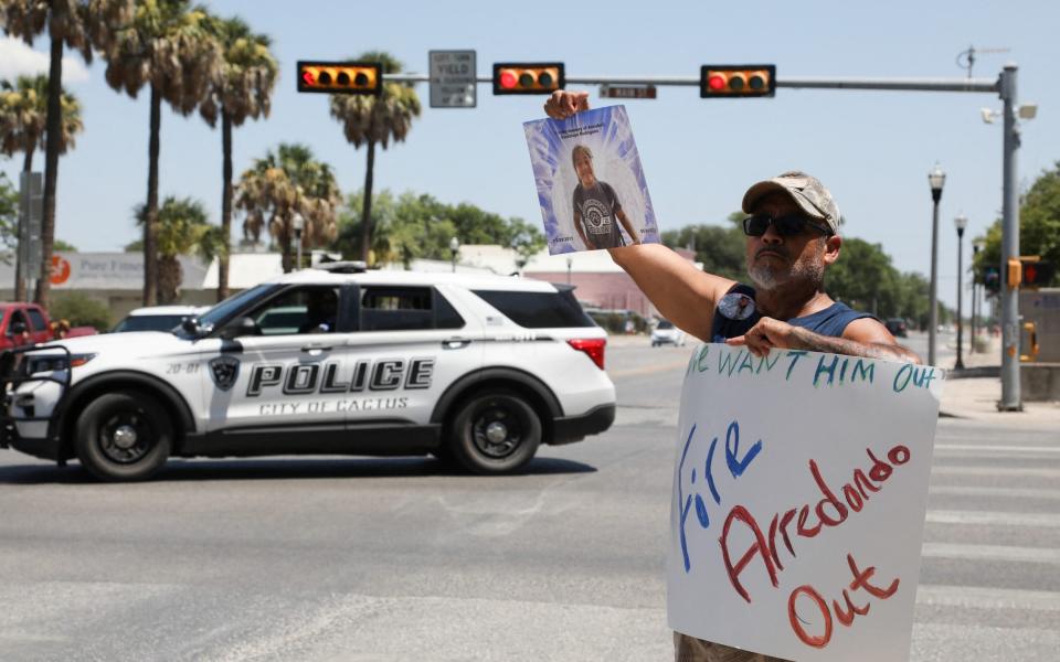  Jessie Rodriguez, the father of Robb Elementary School shooting victim Annabell Guadalupe Rodriguez, 10, holds a photo of her as he protests for the removal of Uvalde schools Police Chief Pete Arredondo, - REUTERS/Lisa Krantz