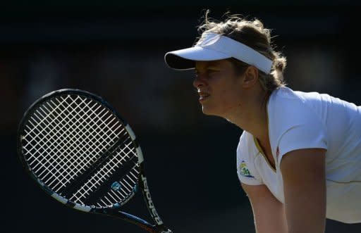 Belgium's Kim Clijsters prepares to receive during her third round women's singles match against Russia's Vera Zvonareva at Wimbledon. Clijsters reached the last 16 when Zvonareva quit with breathing problems. Clijsters was winning 6-3, 4-3 when the match was halted