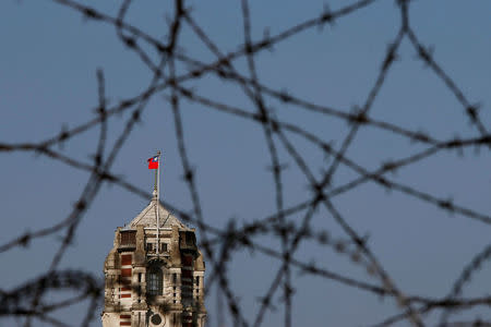 Taiwanese Presidential Office is seen through barbed wire fence during a rally against the overhaul of the military and civil service pension fund, in Taipei,Taiwan January 22, 2017. REUTERS/Tyrone Siu