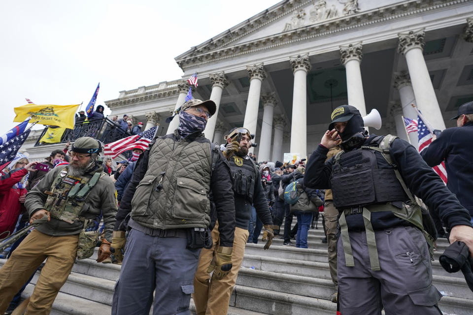 FILE - Members of the Oath Keepers on the East Front of the U.S. Capitol on Jan. 6, 2021, in Washington. A Florida man who stormed the U.S. Capitol with other members of the far-right Oath Keepers testified On Monday, Oct. 31, 2022, that he believed they were participating in a historic “Bastille-type event” reminiscent of the French Revolution. (AP Photo/Manuel Balce Ceneta, File)