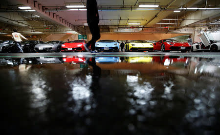 Lamborghini and Ferarri supercars are seen during a meeting of supercar fans at the Umihotaru parking area in Kisarazu, Japan October 21, 2017. Picture taken October 21, 2017. REUTERS/Toru Hanai