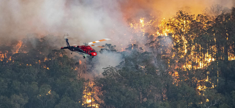 This Monday, Dec. 30, 2019 photo provided by State Government of Victoria shows wildfires in East Gippsland, Victoria state, Australia. Wildfires burning across Australia's two most-populous states trapped residents of a seaside town in apocalyptic conditions Tuesday, Dec. 31, and were feared to have destroyed many properties and caused fatalities. (State Government of Victoria via AP)