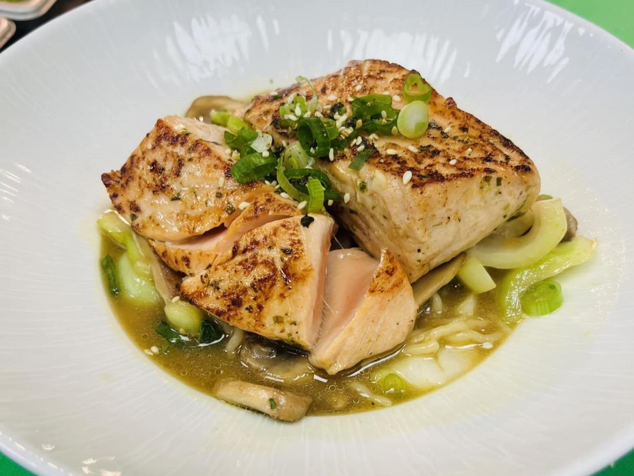 The menu at Blu Ocean Grille in Port St. Lucie features a miso sake salmon ramen bowl with Faroe Island salmon, shiitakes, miso dashi broth, marinated egg, scallions, baby bok choy and Szechuan sauce.