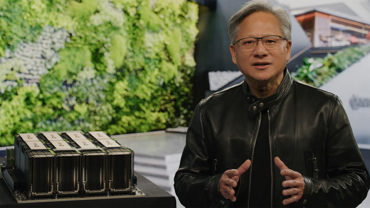  Nvidia CEO Jensen Huang speaking in front of a workstation GPU 