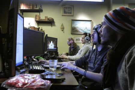 Coders work in the Mojang company office in Stockholm in this January 21, 2013 file photo. REUTERS/Ints Kalnins/Files