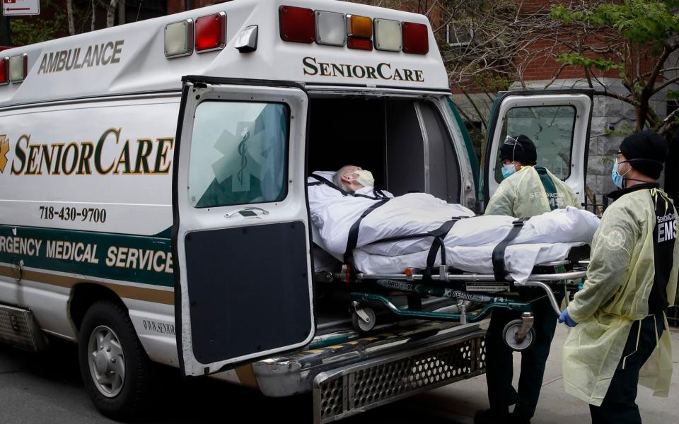 In this April 17, 2020, file photo, a patient is loaded into an ambulance by emergency medical workers outside Cobble Hill Health Center in the Brooklyn borough of New York. Deaths among Medicare patients in nursing homes soared by more than 30% last year, with two devastating surges eight months apart, a government watchdog reported Tuesday in the most complete assessment yet of the ravages of COVID-19 among its most vulnerable victims. - AP