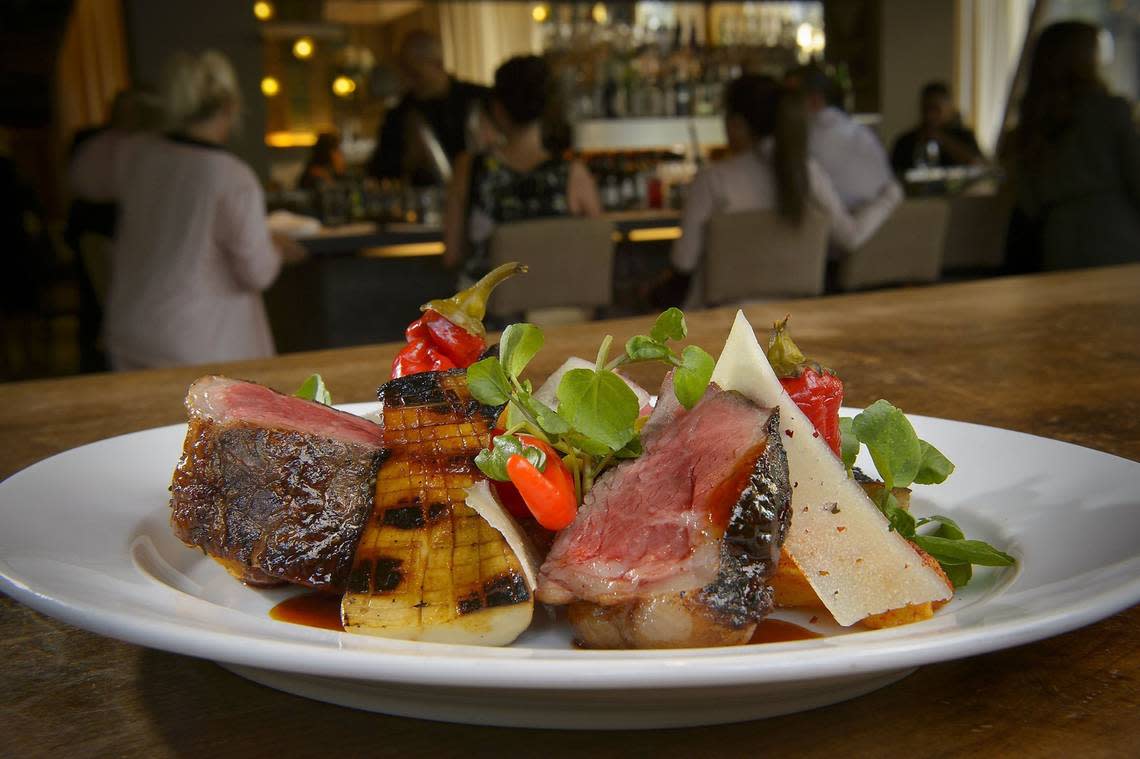 Mesquite grilled New York steak with patatas bravas, king trumpet mushroom, pickled nardello peppers, and Pedro Ximenez glaze at Ella in Sacramento n Tuesday, Sept. 12, 2017. The restaurant is turning 10 years old.