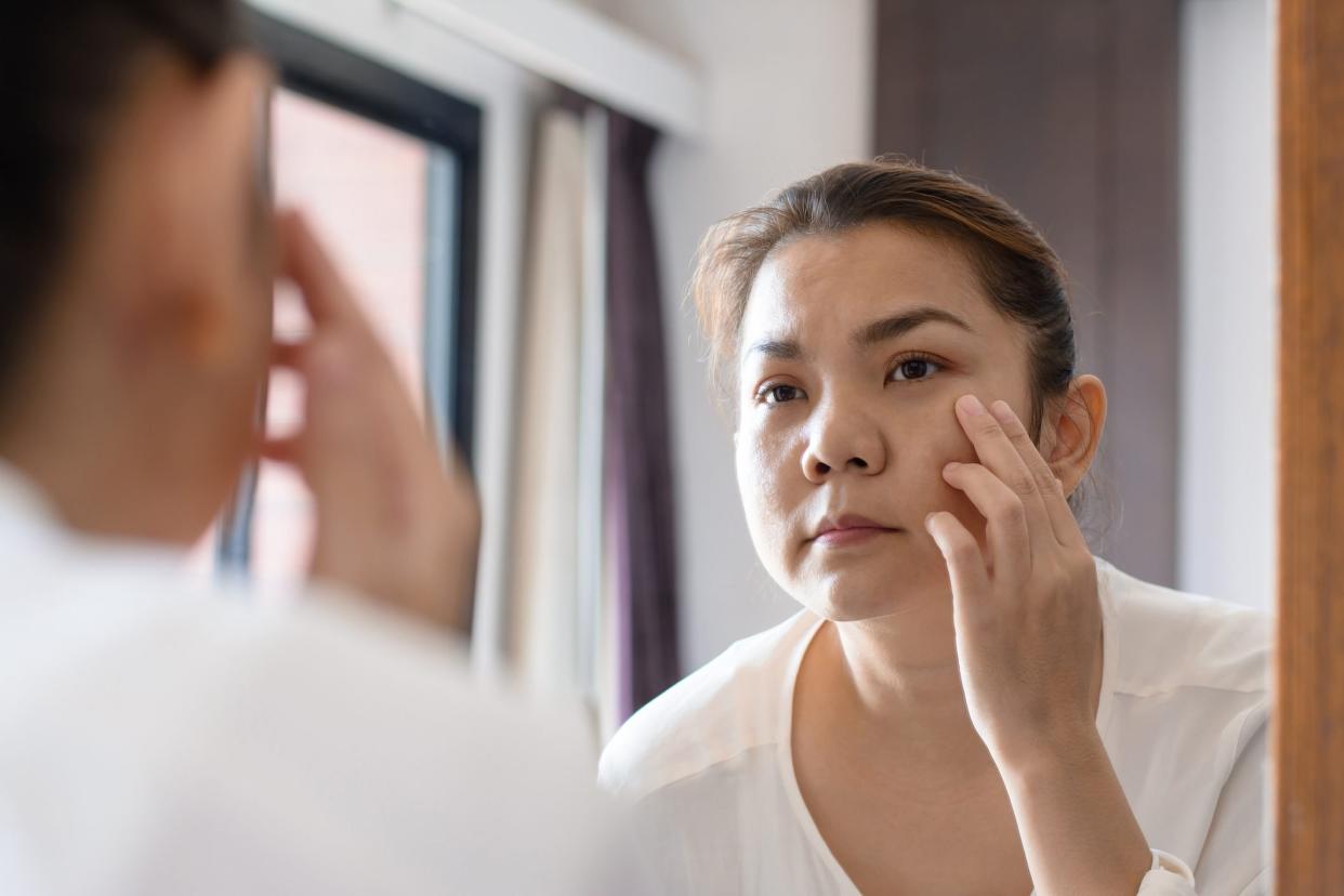 Beautiful Woman In Front Of Mirror With Reflection