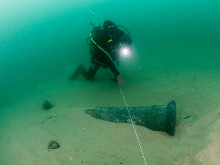 Divers are seen during the discovery of a centuries-old shipwreck, in Cascais in this handout photo released September 24, 2018. Augusto Salgado/Cascais City Hall/Handout via Reuters