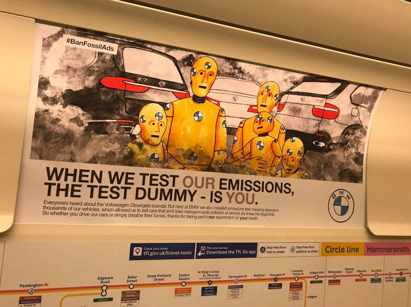 A BMW parody ad designed by Darren Cullen posted in a train car in the London Underground.