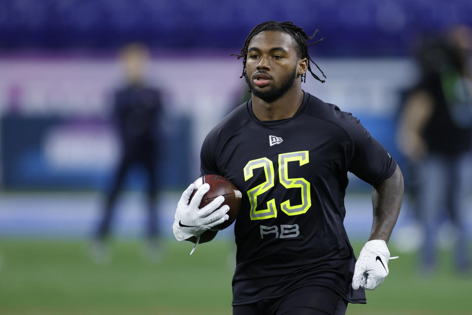 Running back D'Andre Swift runs a drill during the NFL scouting combine in February. (Photo by Joe Robbins/Getty Images)