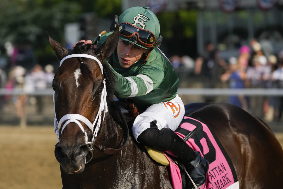Jockey Irad Ortiz, atop Up to the Mark, celebrates after winning The Resorts World Casino Manhattan horse race ahead of the Belmont Stakes horse race, Saturday, June 10, 2023, at Belmont Park in Elmont, N.Y. (AP Photo/Seth Wenig)