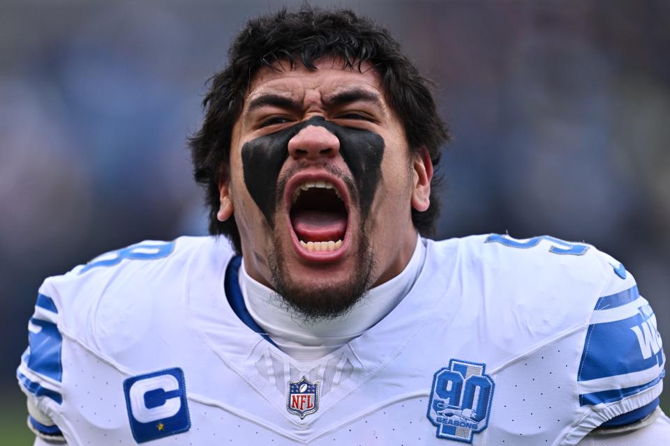 Detroit Lions right tackle Penei Sewell gets fired up before the game against the Chicago Bears at Soldier Field, Dec. 10, 2023 in Chicago.