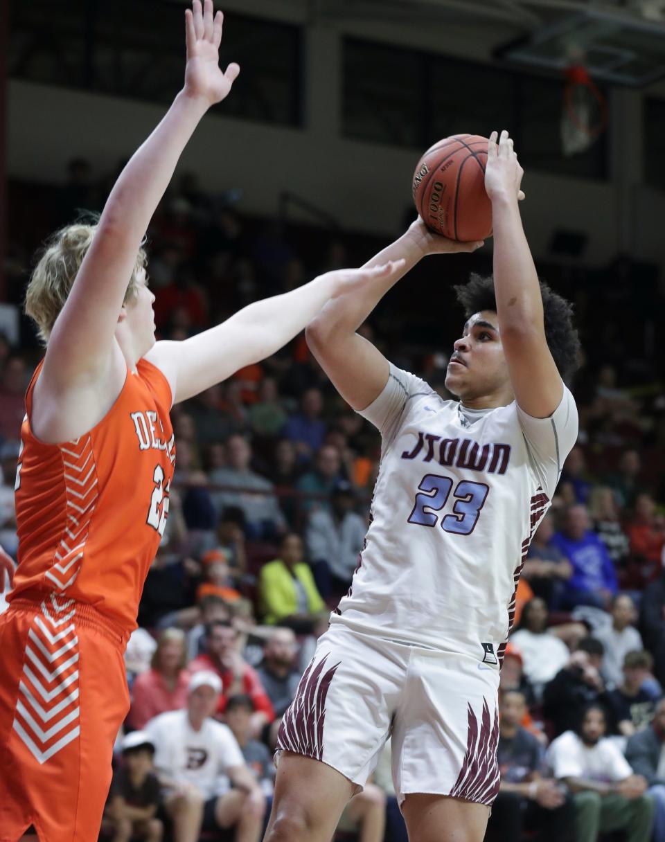 J-Town's Camron McDaniels (23) shot against Desales' William Gibson (22) during the championship of the 6th Region tournament at Bellarmine Knights Hall in Louisville, Ky. on Mar. 6, 2023.