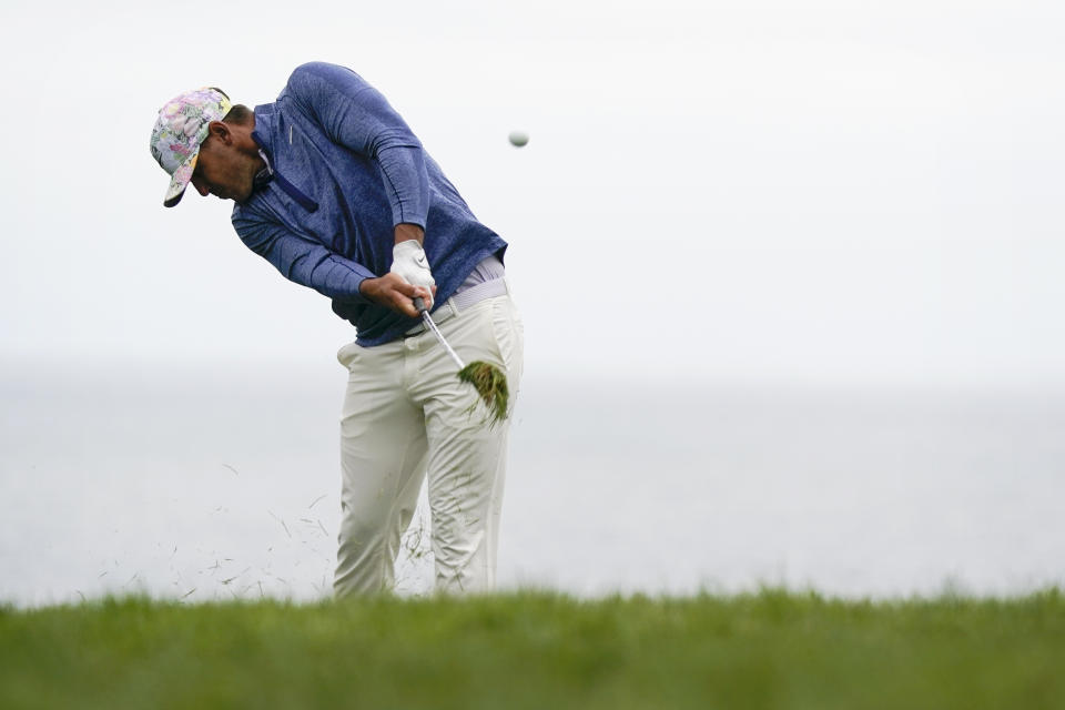 Brooks Koepka hits from the rough on the 11th hole during the first round of the U.S. Open Championship golf tournament Thursday, June 13, 2019, in Pebble Beach, Calif. (AP Photo/David J. Phillip)