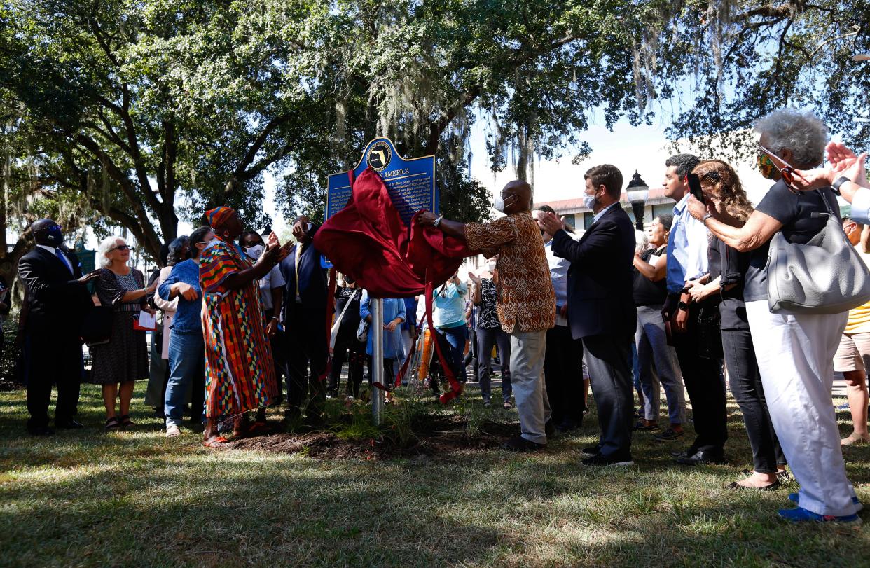 Kenneth Nunn unveils a historical marker outside of the Alachua County Administrative Building in Gainesville. The marker acknowledged the lynchings that took place in the city during Reconstruction and the Jim Crow Era. Nunn's wife, Patricia Hilliard-Nunn, who died last year, contributed to the research that led to the marker.