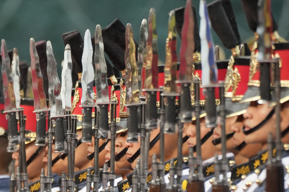 Philippines' troops stand at attention during the 88th anniversary of the Armed Forces of the Philippines at Camp Aguinaldo military headquarters in Quezon city, Philippines on Thursday, Dec. 21, 2023. (AP Photo/Aaron Favila)