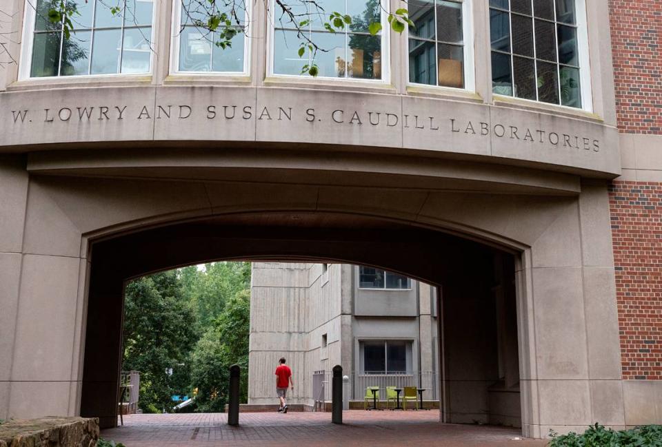 A person walks by Caudill Laboratories on the campus of UNC-Chapel Hill on Tuesday, Aug. 29, 2023.