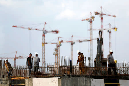 Labourers work at a construction site in the new neighbourhood of Carmei Gat in the southern Israeli city of Kiryat Gat November 1, 2016. REUTERS/Amir Cohen