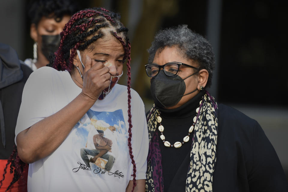 FILE - Jena Black, left, mother of Anton Black, a young Black man that died in police custody, is consoled by community activist Rene Swafford during a press conference Thursday, Sept. 30, 2021, in Baltimore. A federal judge on Tuesday, Jan. 19, 2022, has refused to throw out a lawsuit’s claims that police on Maryland’s Eastern Shore used excessive force on Anton Black, a 19-year-old Black man who died in 2018 during a struggle with officers who handcuffed him and shackled his legs. .(AP Photo/Gail Burton, File)