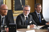 Goran K Hansson, Secretary General of the Royal Swedish Academy of Sciences, center, and academy members Peter Fredriksson, left, and Jakob Svensson announce the winners of the 2019 Nobel Prize in Economics during a news conference at the Royal Swedish Academy of Sciences in Stockholm, Sweden, Monday Oct. 14, 2019. The Nobel prize in economics has been awarded to Abhijit Banerjee, Esther Duflo and Michael Kremer "for their experimental approach to alleviating global poverty." (Karin Wesslen/TT via AP)