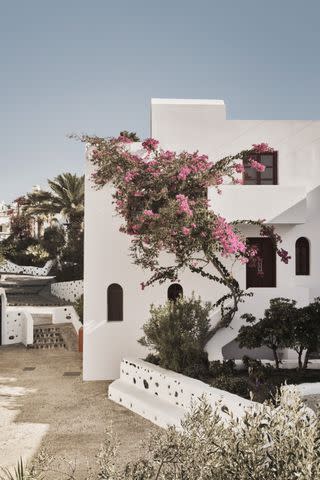 <p>COURTESY OF VEDEMA RESORT</p> Classic Cyclades architecture at Vedema resort on Santorini, Greece..