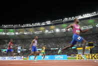 Noah Lyles, of the United States wins the gold medal in the Men's 200-meters final during the World Athletics Championships in Budapest, Hungary, Friday, Aug. 25, 2023. (AP Photo/David Phillip)