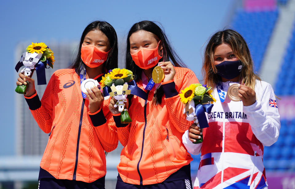 Great Britain's Sky Brown (right) celebrates winning the bronze medal, alongside Japan's Sakura Yosozumi who won gold and Japan's Sakura Kokona Hiraki (left) who won silver during the Women's Park Final at Ariake Sports Park on the twelfth day of the Tokyo 2020 Olympic Games in Japan. Picture date: Wednesday August 4, 2021. (Photo by Adam Davy/PA Images via Getty Images)