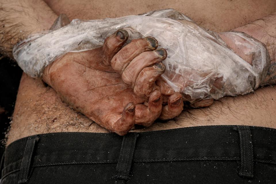 The body of a man who was killed with his hands tied behind his back lies on the ground in Bucha, Ukraine (Copyright 2022 The Associated Press. All rights reserved.)