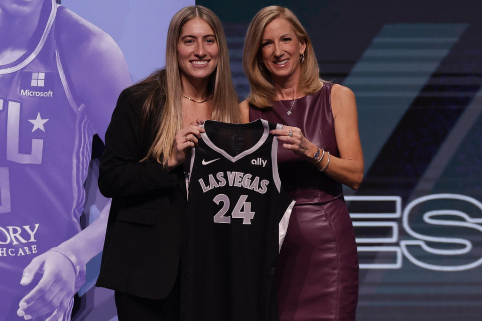 Iowa’s Kate Martin, left, poses for a photo with WNBA commissioner Cathy Engelbert, right, after being selected 18th overall by the Las Vegas Aces during the second round of the WNBA basketball draft on Monday, April 15, 2024, in New York. (AP Photo/Adam Hunger)