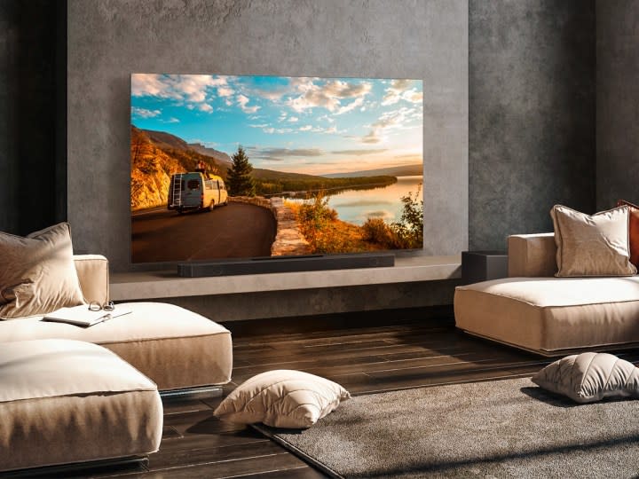 The Samsung Q-Series 11.1.4-channel surround sound system set up in a luxurious living room.