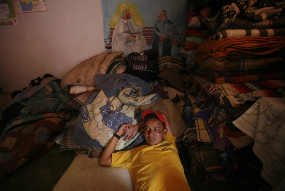 In this May 12, 2012 photo, Eric Acosta, a migrant from Honduras, recovers from a fall he suffered while trying to climb a north bound train, at a migrant shelter in Lecheria, on the outskirts of Mexico City. While the number of Mexicans heading to the U.S. has dropped dramatically, a surge of Central American migrants is making the 1,000-mile northbound journey this year, fueled in large part by the rising violence brought by the spread of Mexican drug cartels. (AP Photo/Marco Ugarte)