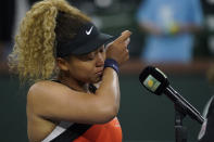 Naomi Osaka, of Japan, is emotional as she speaks to the crowd after losing her match to Veronika Kudermetova, of Russia, at the BNP Paribas Open tennis tournament Saturday, March 12, 2022, in Indian Wells, Calif. (AP Photo/Mark J. Terrill)