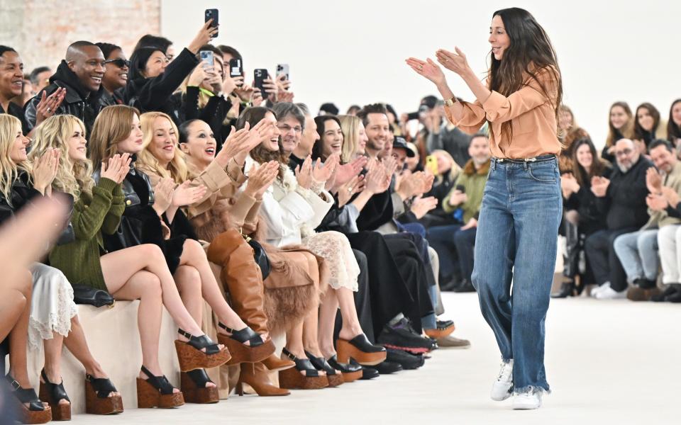 Chemena Kamali, the creative director at Chloé, walks the runway after the show