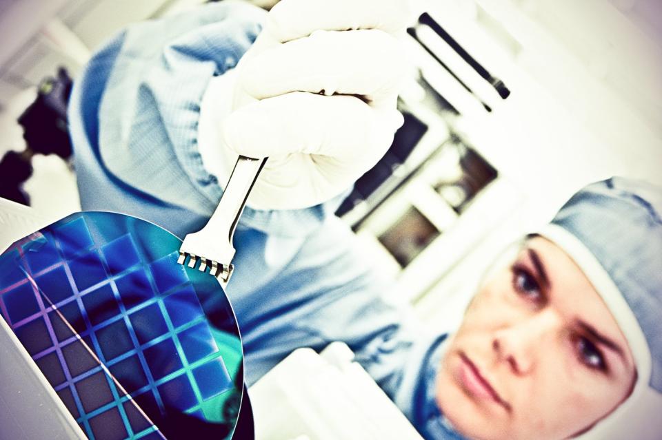 A person working in a fabrication facility.