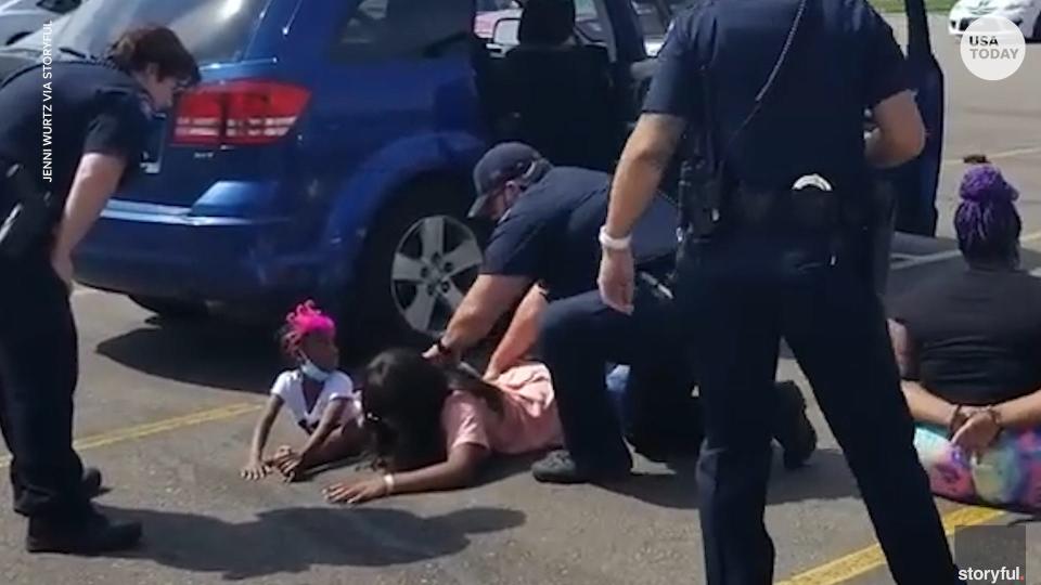 Aurora, Colo., police officers drew their guns and handcuffed a woman and four children after mistaking their car for a stolen vehicle.