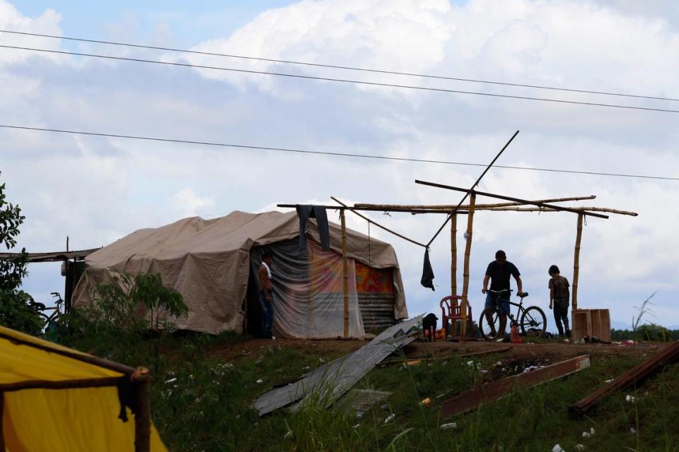 People living under precarious conditions make preparations before Hurricane Iota makes landfall in San Manuel Cortes, Honduras, Monday, November 16, 2020.