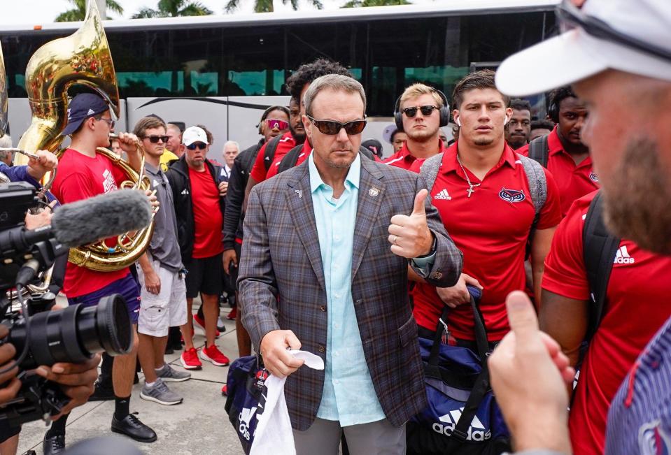 Florida Atlantic head coach Tom Herman walks with his team at the Owl Walk at FAU Stadium on Saturday, September 2, 2023, in Boca Raton, FL.