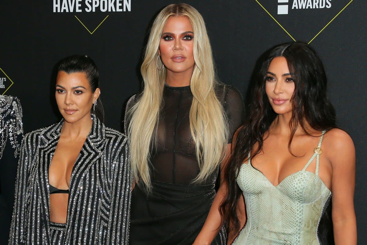 Kim Kardashian has shared a photo with her sisters, following feud rumours  (AFP via Getty Images)