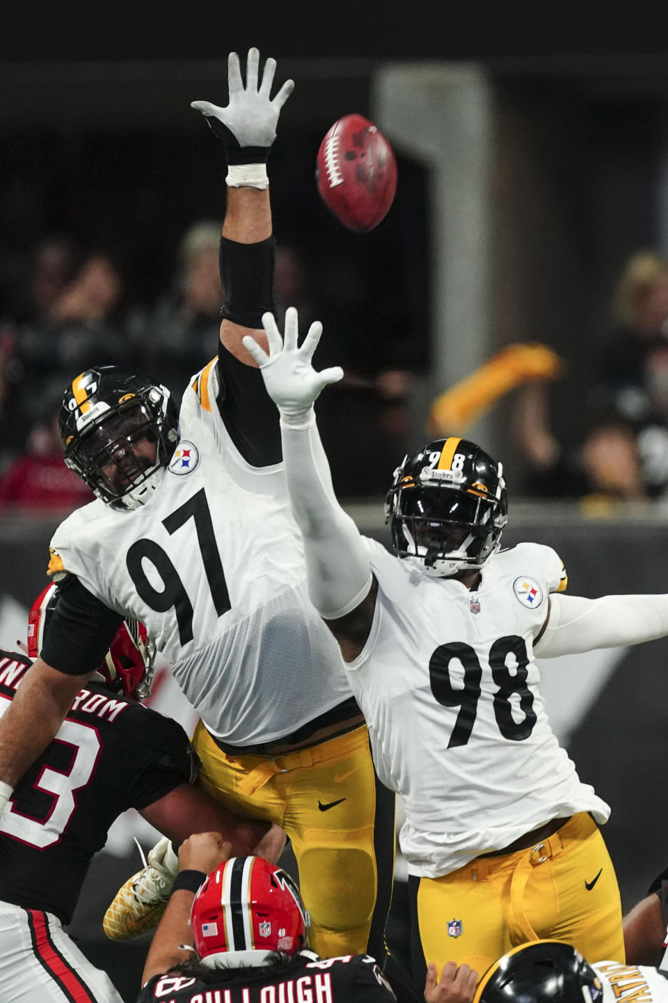 Pittsburgh Steelers defensive tackle Cameron Heyward (97) and defensive end DeMarvin Leal (98) attempt a block on a field goal by the Atlanta Falcons during the first half of an NFL football game, Sunday, Dec. 4, 2022, in Atlanta. (AP Photo/John Bazemore)