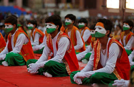 Performers wait for Prime Minister Narendra Modi to address an election campaign meeting ahead of Gujarat state assembly elections, in Ahmedabad, December 3, 2017. REUTERS/Amit Dave